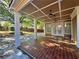 Inviting covered patio with stained concrete floors and a view of the backyard with privacy fence at 1417 Wind Chime Ct, Lawrenceville, GA 30045