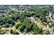 An aerial view of a lush neighborhood with mature trees and well-maintained homes, offering a serene residential setting at 3366 English Oaks Nw Dr, Kennesaw, GA 30144