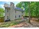 Back of house shows large, fenced backyard with patio, grill, and picnic table ready for outdoor dining and entertaining at 3366 English Oaks Nw Dr, Kennesaw, GA 30144