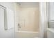 Simple and clean bathroom showcasing a tub and shower, plus a towel rack at 3366 English Oaks Nw Dr, Kennesaw, GA 30144