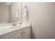 Well-lit powder room features a pristine white vanity with bright finishes and neutral decor at 3366 English Oaks Nw Dr, Kennesaw, GA 30144