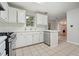Bright, open kitchen with white cabinets and stainless steel dishwasher at 3366 English Oaks Nw Dr, Kennesaw, GA 30144