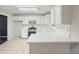 This spacious kitchen features white cabinets and a gas range at 3366 English Oaks Nw Dr, Kennesaw, GA 30144