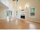 Bright living room showcases a fireplace, large windows, and an open layout at 3366 English Oaks Nw Dr, Kennesaw, GA 30144