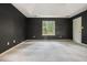 Spacious main bedroom with neutral carpet, paint, natural light, and tray ceiling at 3366 English Oaks Nw Dr, Kennesaw, GA 30144