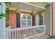 Cozy front porch with white railings, hanging flower baskets, and a welcoming entrance at 3366 English Oaks Nw Dr, Kennesaw, GA 30144