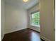 Cozy bedroom featuring hardwood floors and a sunny window at 195 14Th Ne St # 303, Atlanta, GA 30309