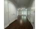 Hallway leading into a living room with hardwood floors and natural light at 195 14Th Ne St # 303, Atlanta, GA 30309