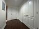 Condo hallway with dark wood floors, a closet, and a neutral color scheme at 195 14Th Ne St # 303, Atlanta, GA 30309