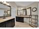 Large bathroom featuring dual vanities, a makeup area, tile floors, and framed mirrors at 202 Roseman Way, Woodstock, GA 30188