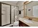 Well-maintained bathroom featuring a glass-enclosed shower, updated vanity, and neutral decor at 202 Roseman Way, Woodstock, GA 30188
