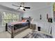 Cozy bedroom with natural light, decorative accents, and a comfortable bed for a restful retreat at 202 Roseman Way, Woodstock, GA 30188