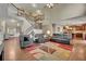 Open concept living room featuring a grand staircase, hardwood floors, and an inviting layout perfect for gatherings at 202 Roseman Way, Woodstock, GA 30188