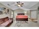 Spacious main bedroom featuring a ceiling fan, comfortable furnishings, neutral walls, and vaulted ceilings at 202 Roseman Way, Woodstock, GA 30188