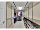 A well-organized walk-in closet featuring metal shelving and hanging rods for ample storage at 202 Roseman Way, Woodstock, GA 30188