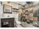 This bathroom features modern fixtures, walk in shower with pebble flooring, and built in shelving at 2067 Skyhawk Ln, Acworth, GA 30102