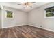 Bright bedroom featuring modern light fixture, fresh paint, new flooring and natural light at 2067 Skyhawk Ln, Acworth, GA 30102