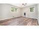 Bright bedroom featuring modern light fixture, fresh paint, new flooring and natural light at 2067 Skyhawk Ln, Acworth, GA 30102