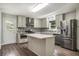This modern kitchen has stainless appliances, stone backsplash, eat in island, and plenty of cabinet space at 2067 Skyhawk Ln, Acworth, GA 30102