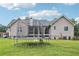 Spacious backyard with well-maintained lawn and a trampoline at 2118 Braswell Ln, Loganville, GA 30052