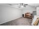 Unfinished basement bedroom with fan and carpet at 2118 Braswell Ln, Loganville, GA 30052