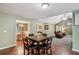 Bright dining area with hardwood floors, adjacent to the kitchen and living room at 2118 Braswell Ln, Loganville, GA 30052