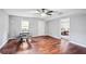 Dining area with hardwood floors, ceiling fan, and access to the bedroom at 2118 Braswell Ln, Loganville, GA 30052