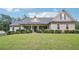 Charming home featuring beautiful stone and siding exterior with well-manicured landscaping at 2118 Braswell Ln, Loganville, GA 30052