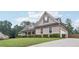 Attractive home with a mix of stone and siding, complemented by a well-groomed lawn and driveway at 2118 Braswell Ln, Loganville, GA 30052