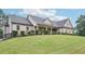 Beautiful home with a stone and siding exterior and a neatly kept lawn at 2118 Braswell Ln, Loganville, GA 30052