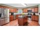 This beautiful kitchen boasts stainless steel appliances, wooden cabinets, and center island at 2118 Braswell Ln, Loganville, GA 30052