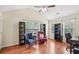 This home office features wood floors, large windows, neutral paint, and vaulted ceiling at 2118 Braswell Ln, Loganville, GA 30052