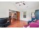 This home office features wood floors, large windows, neutral paint, and vaulted ceiling at 2118 Braswell Ln, Loganville, GA 30052