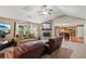 Open concept living room with a stone fireplace and seamless connection to the kitchen and dining area at 2118 Braswell Ln, Loganville, GA 30052