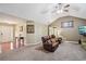 Spacious living room with a vaulted ceiling, TV, comfortable seating and access to the foyer at 2118 Braswell Ln, Loganville, GA 30052