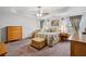 Spacious main bedroom featuring a ceiling fan, neutral paint, and tray ceilings at 2118 Braswell Ln, Loganville, GA 30052