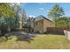 Charming home with a spacious backyard, patio, and upper level wood deck at 2335 Corbett Ct, Powder Springs, GA 30127