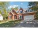 Beautiful red brick home with manicured lawn, and a two car garage at 2335 Corbett Ct, Powder Springs, GA 30127