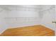 Spacious walk-in closet with hardwood flooring and wire shelving at 2335 Corbett Ct, Powder Springs, GA 30127