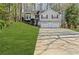 Well-maintained split-level home with a two-car garage and lush front yard, offering curb appeal at 305 Bridgewater Ter, Canton, GA 30115