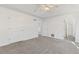 Spacious main bedroom with plush gray carpet, ceiling fan, and access to a large ensuite bathroom at 305 Bridgewater Ter, Canton, GA 30115
