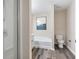 Bathroom showcasing a shower, tub, toilet, wood floors, and an art piece at 2377 Heritage Park Nw Cir # 16, Kennesaw, GA 30144