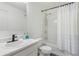 Bathroom with a single sink vanity, shower-tub combo with shower curtain and sleek fixtures at 2377 Heritage Park Nw Cir # 16, Kennesaw, GA 30144