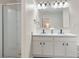 Bathroom features a double sink vanity, a large mirror with lighting, and a walk-in shower at 2377 Heritage Park Nw Cir # 16, Kennesaw, GA 30144