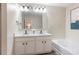 Bright bathroom with double sink, white vanity, large mirror, and tub and shower combination at 2377 Heritage Park Nw Cir # 16, Kennesaw, GA 30144