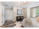 Bright bedroom featuring wood-look floors, a modern light, and neutral walls at 2377 Heritage Park Nw Cir # 16, Kennesaw, GA 30144