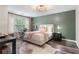 Cozy bedroom featuring a large window, neutral walls, and modern décor at 2377 Heritage Park Nw Cir # 16, Kennesaw, GA 30144