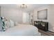 Bedroom featuring a modern light fixture, contemporary art, and a console table at 2377 Heritage Park Nw Cir # 16, Kennesaw, GA 30144