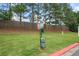 Well-maintained community dog park featuring fresh green grass, a trash receptacle, and waste bag dispenser at 2377 Heritage Park Nw Cir # 16, Kennesaw, GA 30144