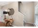 Elegant foyer showcasing hardwood floors, a decorative table with mirrors, and staircase access at 2377 Heritage Park Nw Cir # 16, Kennesaw, GA 30144